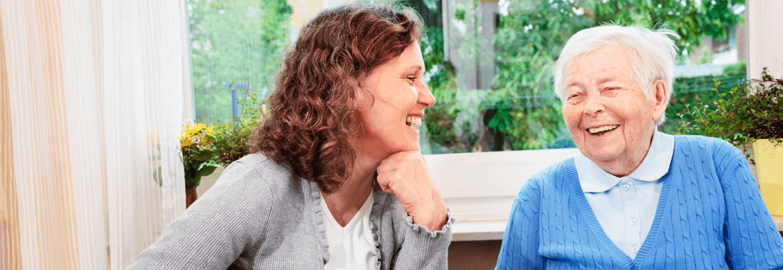 Older woman laughs with companion